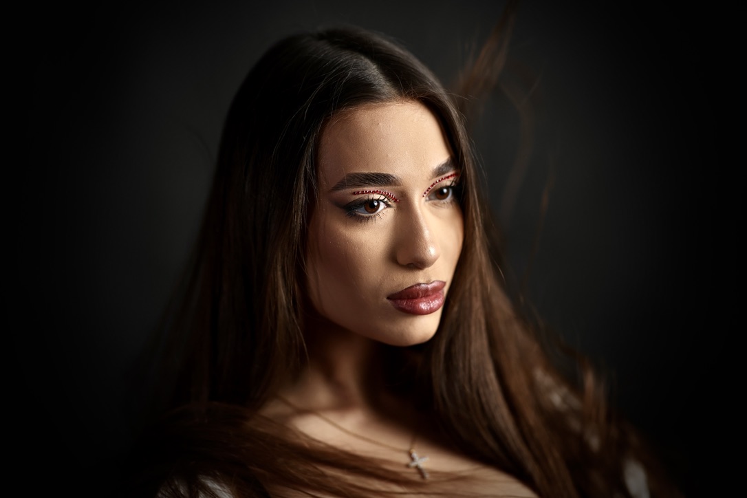 Beauty portrait with crystal eye detail and windswept hair